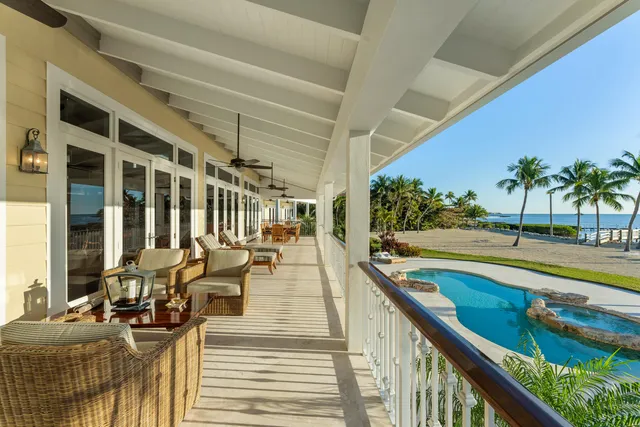 a front view of a house with a garden and yard