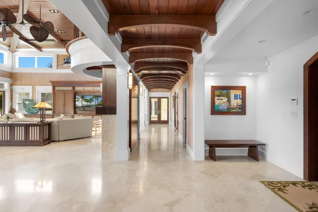 a view of a house with swimming pool and sitting area