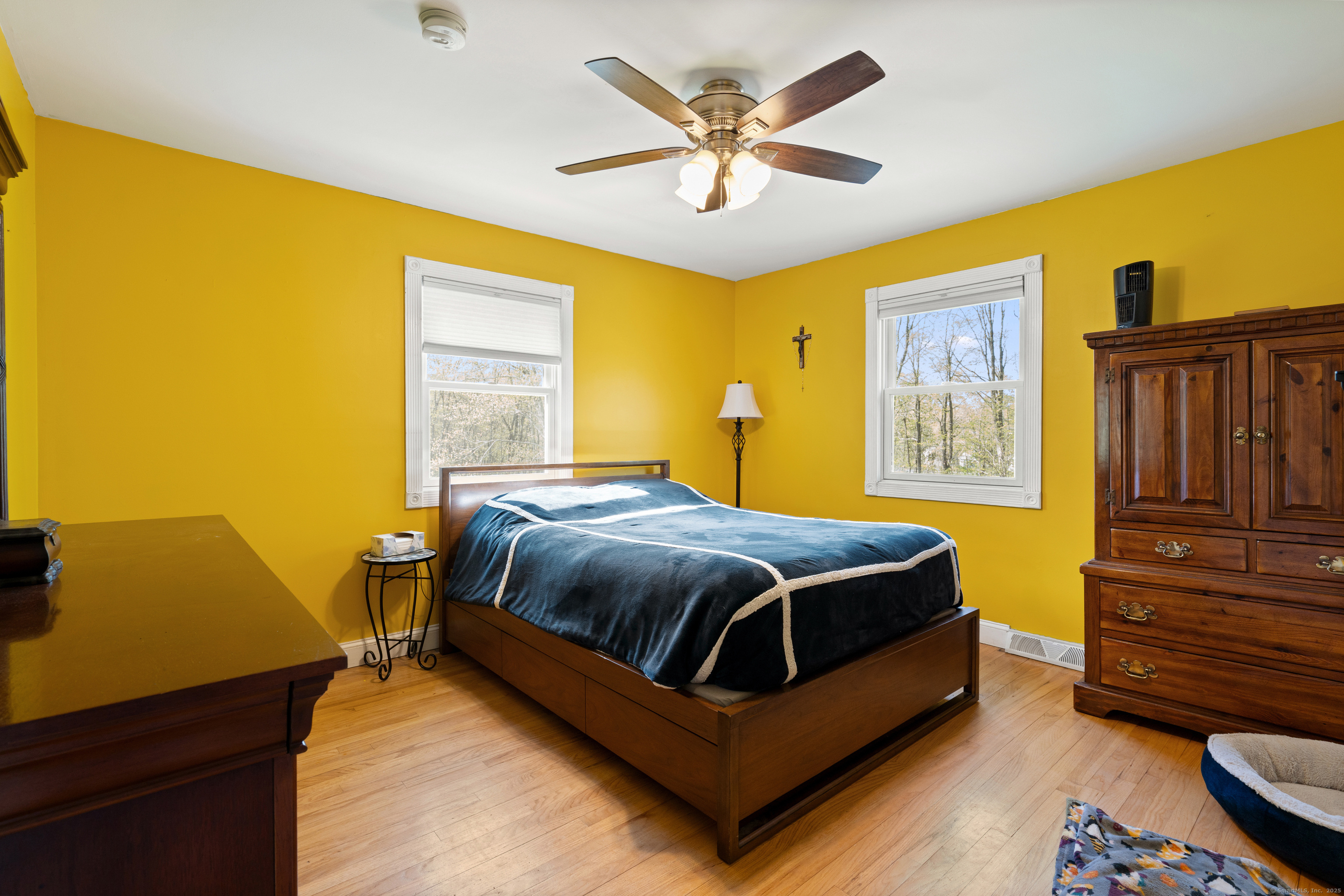 2 Pine Hill Road New Fairfield, CT 06812 - Photo 13 of 40 a bedroom with a bed and wooden floor