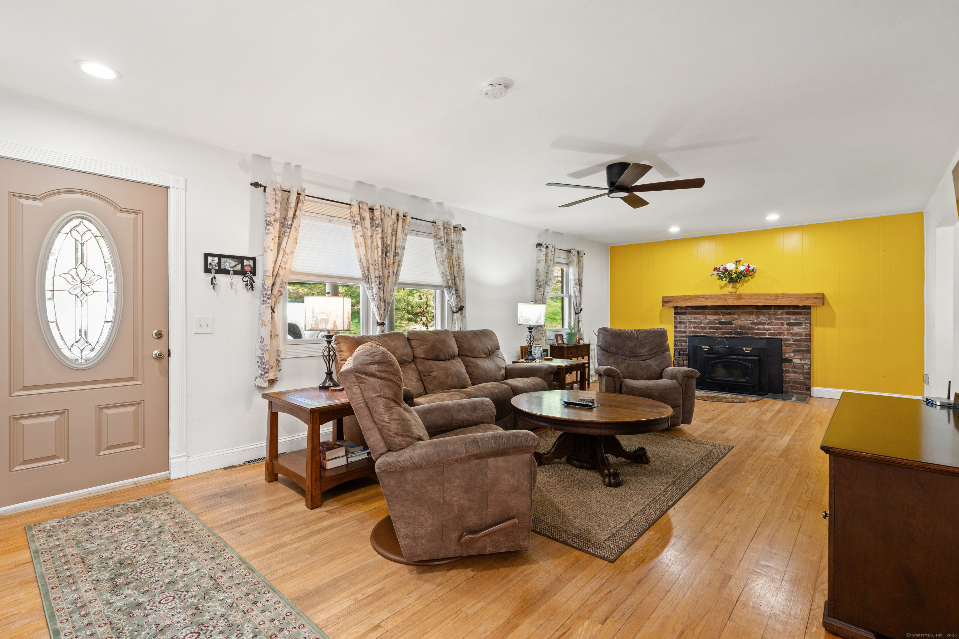 2 Pine Hill Road New Fairfield, CT 06812 - Photo 2 of 40 a living room with fireplace furniture and a rug