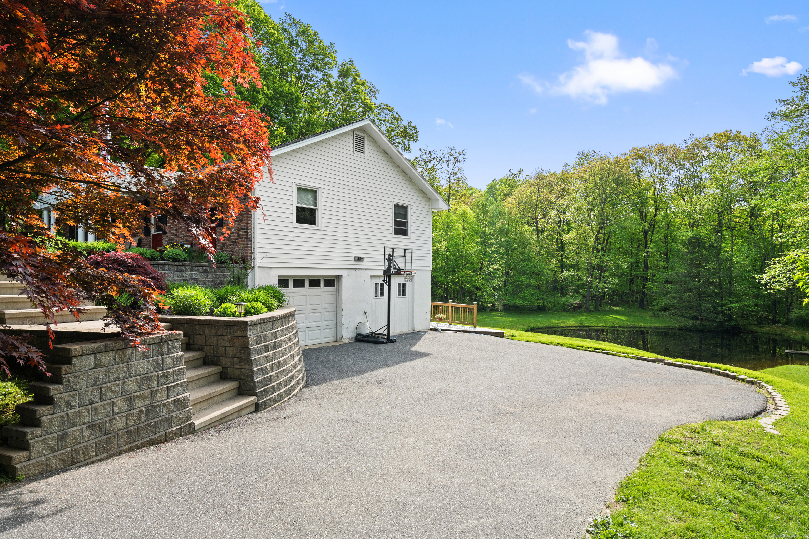 2 Pine Hill Road New Fairfield, CT 06812 - Photo 31 of 40 a backyard of a house with table and chairs