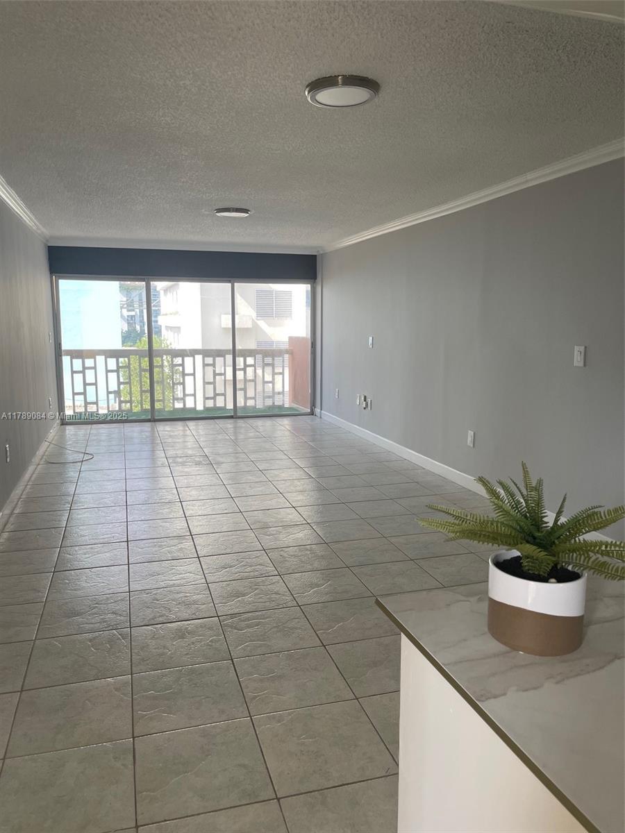 600 Northeast 25th Street, Unit 60 Miami, FL 33137 - Photo 2 of 10 a view of an empty room and window