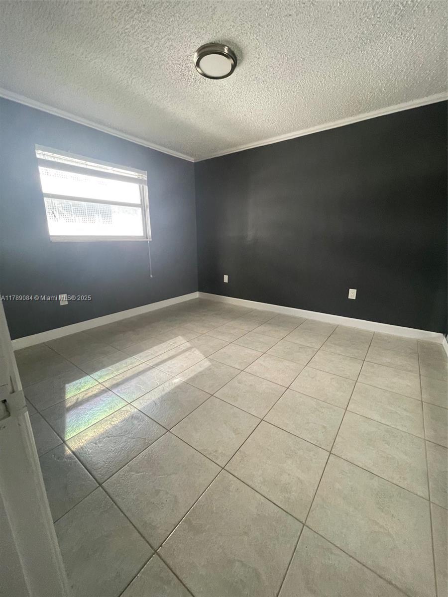 600 Northeast 25th Street, Unit 60 Miami, FL 33137 - Photo 5 of 10 a view of an empty room with a window
