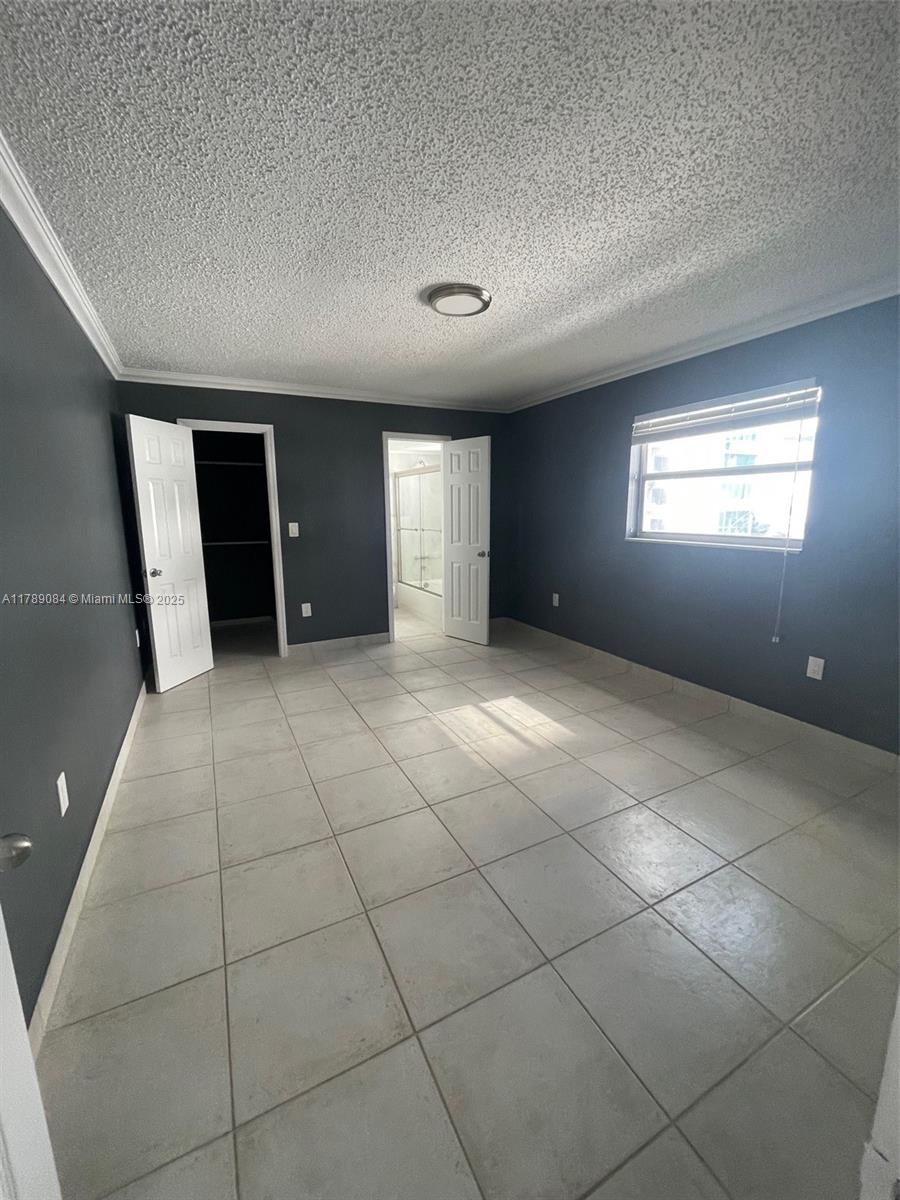 600 Northeast 25th Street, Unit 60 Miami, FL 33137 - Photo 7 of 10 a view of an empty room with a window