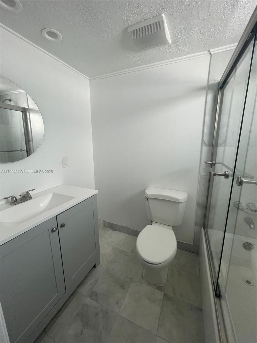 600 Northeast 25th Street, Unit 60 Miami, FL 33137 - Photo 8 of 10 a bathroom with a sink toilet and shower