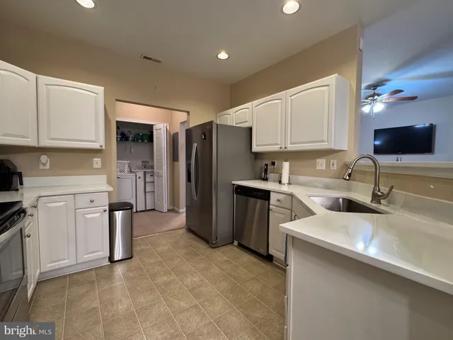 a kitchen with a table and chairs in it