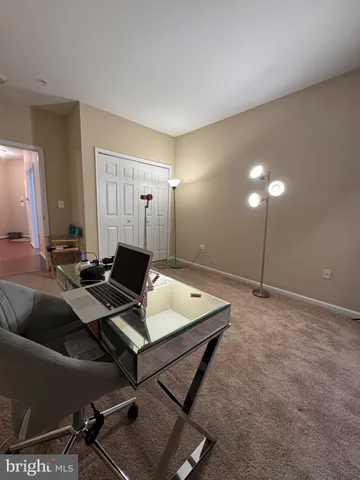 a view of an empty room and room with windows