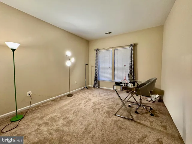 a view of a workspace with furniture