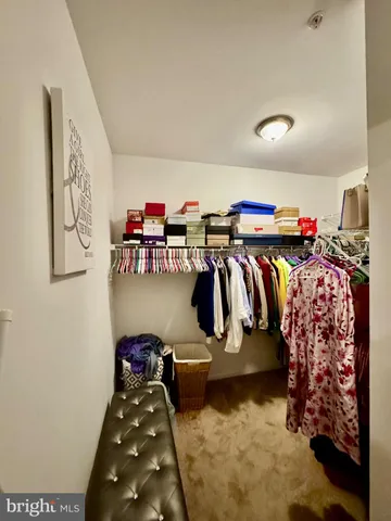 a bed room with a bed and two window