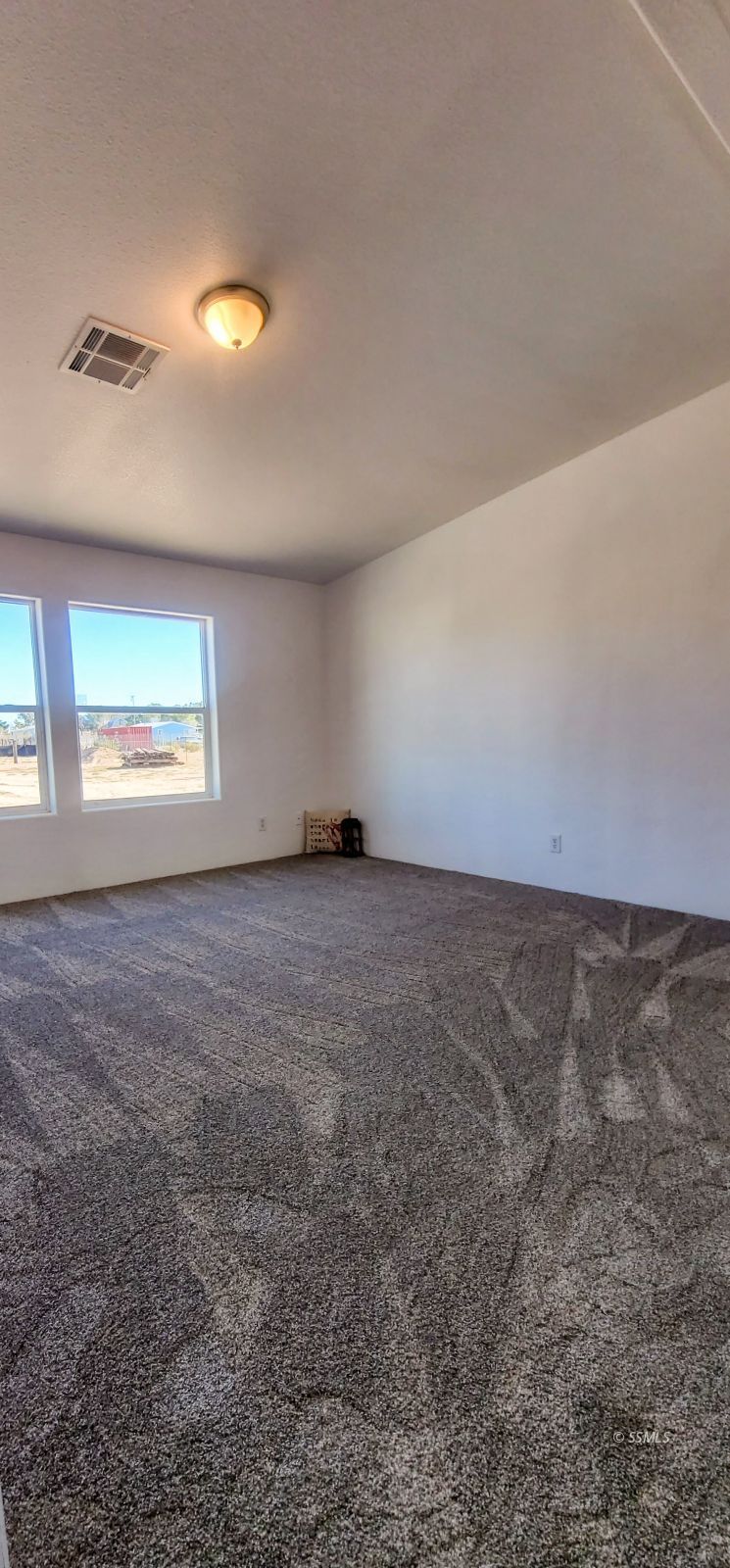 1056 North Alford Street Ridgecrest, CA 93555 - Photo 16 of 24 a view of an empty room with a window
