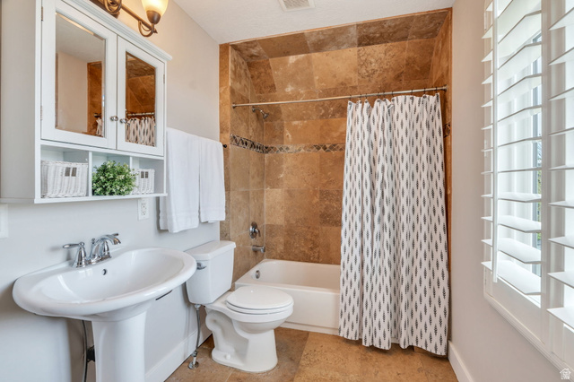 1355 West 1000 South Mapleton, UT 84664 - Photo 38 of 74 Bathroom featuring toilet and shower / bath combo with shower curtain