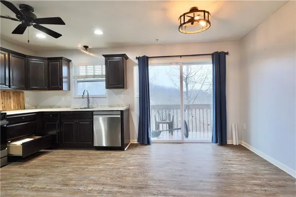a kitchen with a refrigerator and a sink