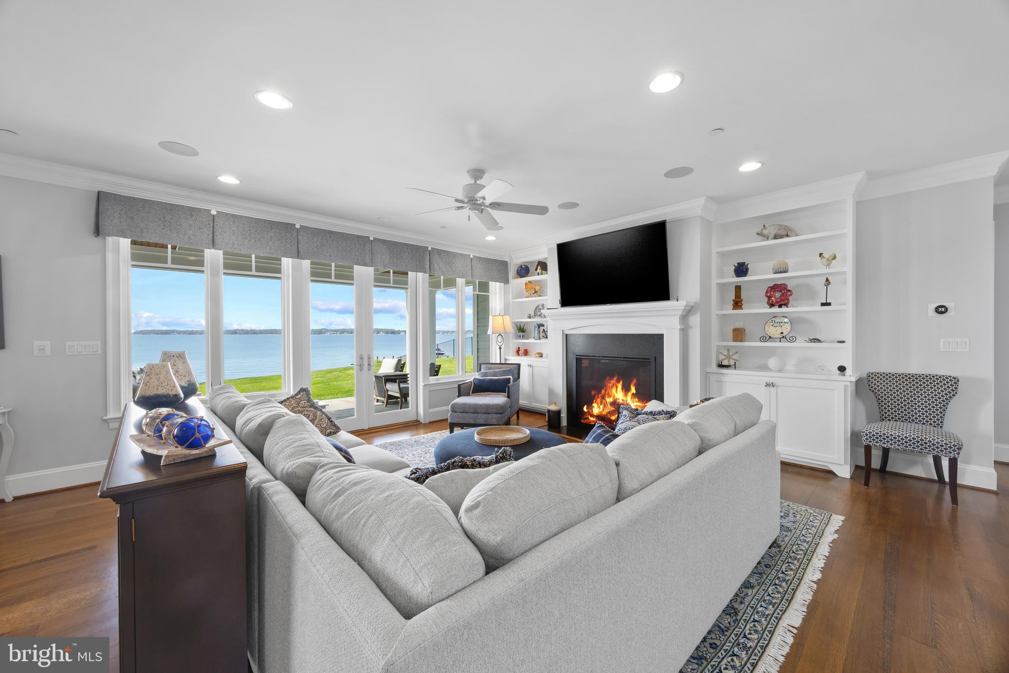 3736 Ramsgate Drive Annapolis, MD 21403 - Photo 7 of 45 Living room with cozy fireplace and exterior patio