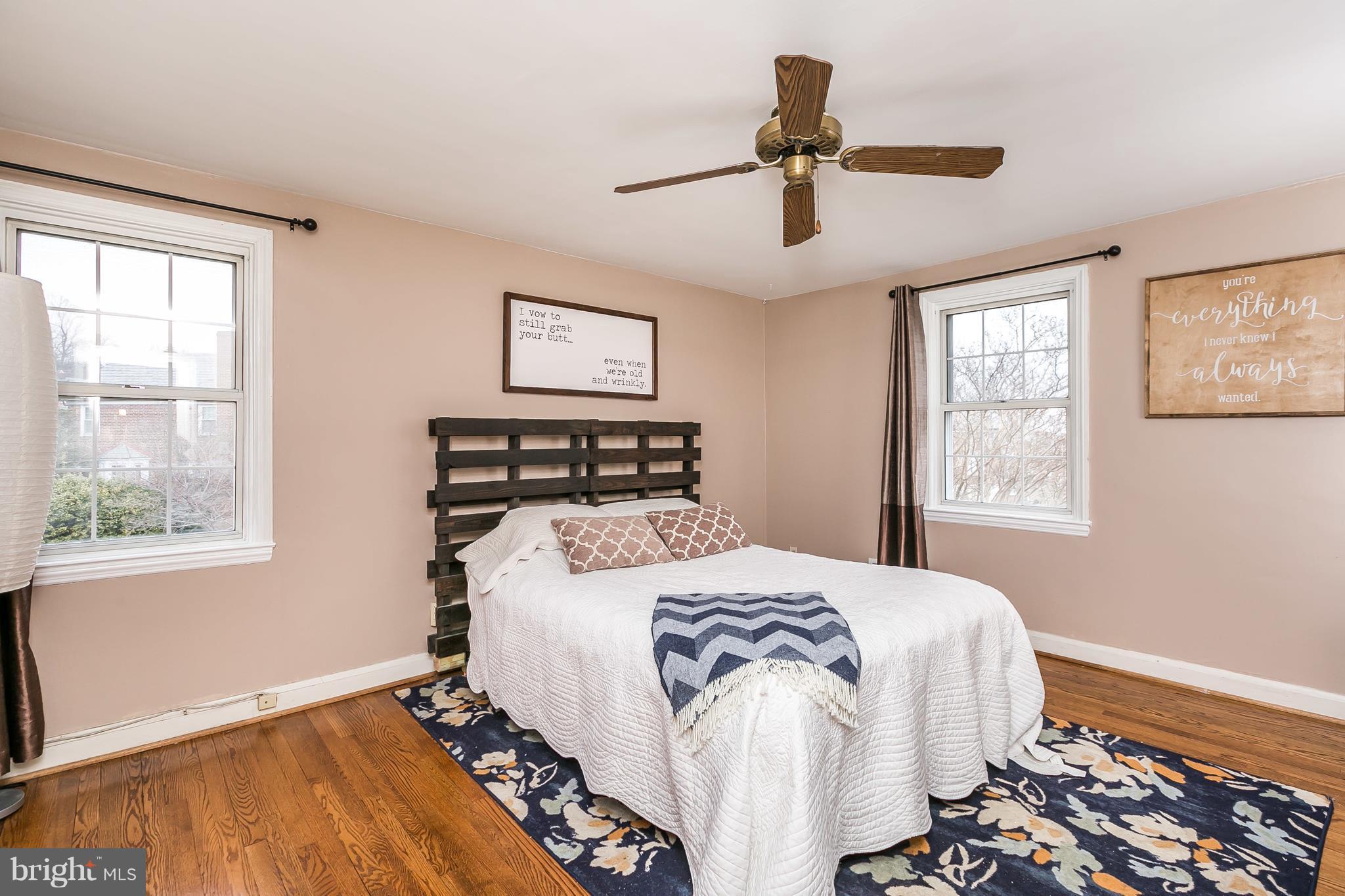 362 Greenlow Road Baltimore, MD 21228 - Photo 13 of 30 a bedroom with a bed and wooden floor