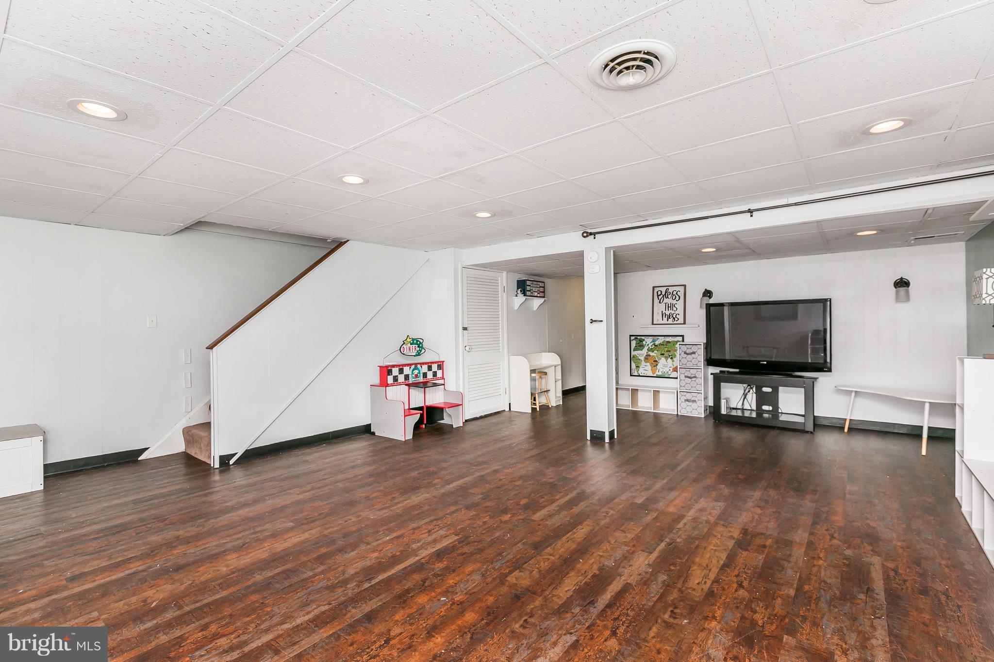 362 Greenlow Road Baltimore, MD 21228 - Photo 19 of 30 a view of a room with wooden floor and furniture