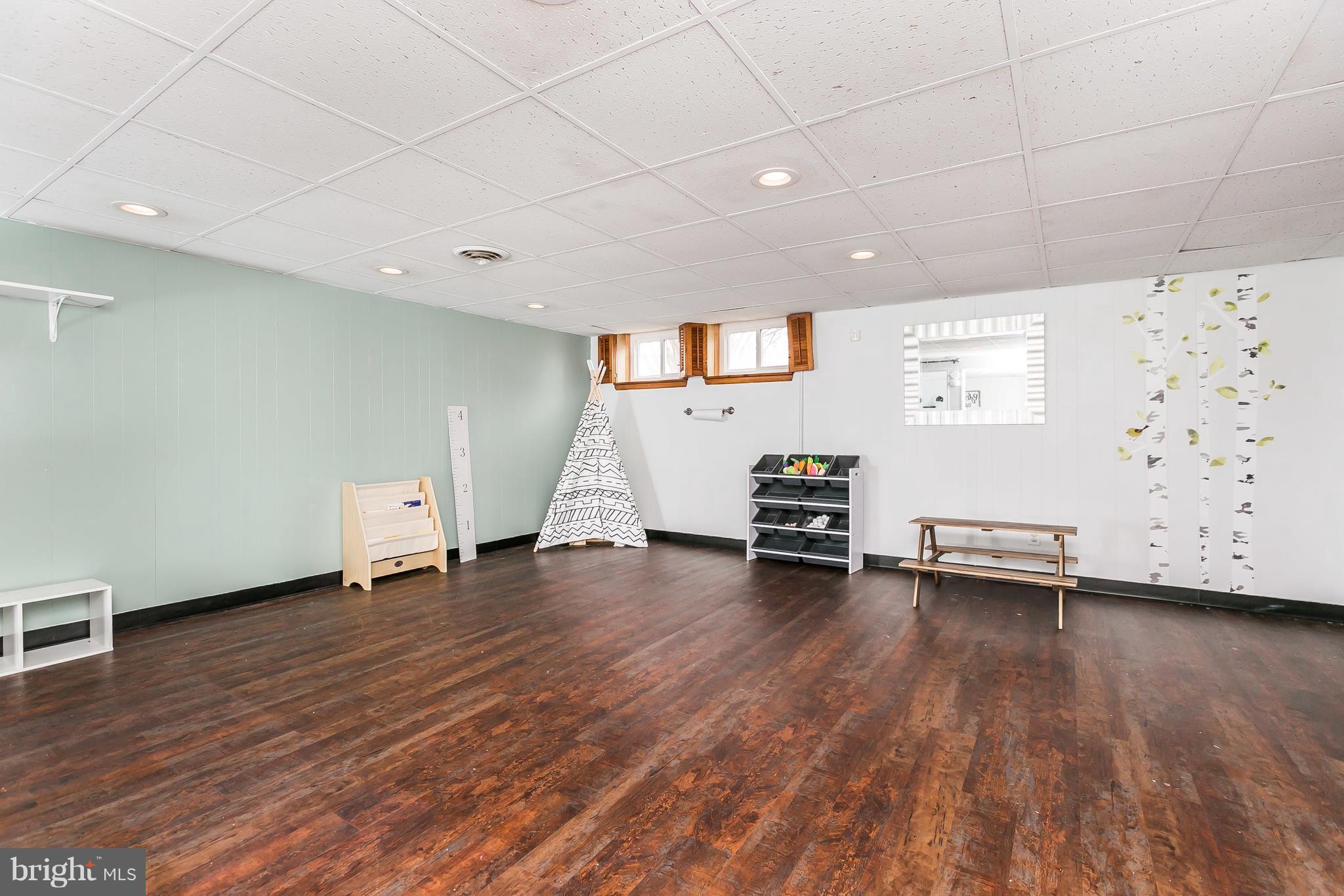 362 Greenlow Road Baltimore, MD 21228 - Photo 20 of 30 a view of a room with wooden floor and white walls