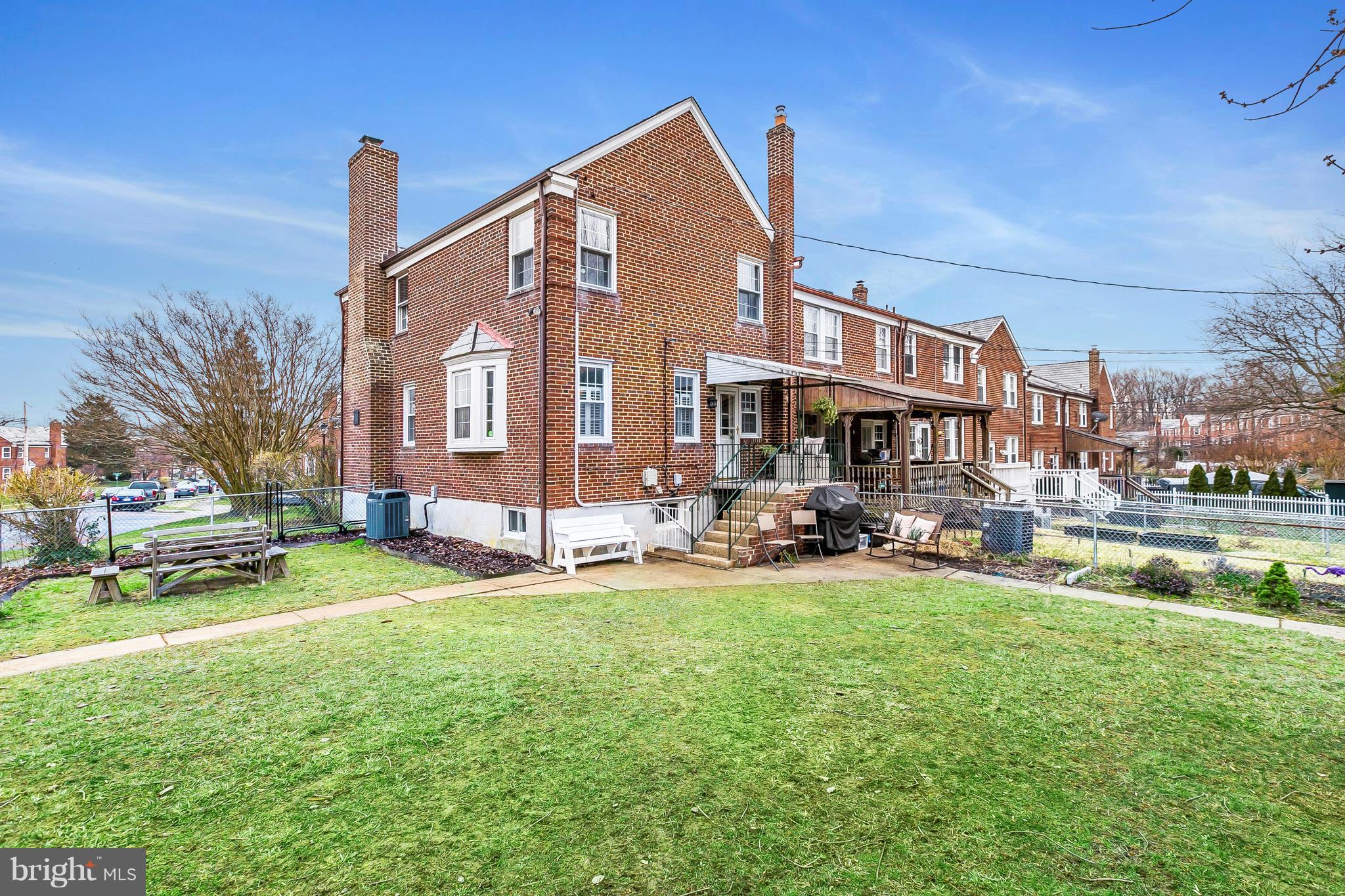 362 Greenlow Road Baltimore, MD 21228 - Photo 23 of 30 a view of a building with a yard and sitting area