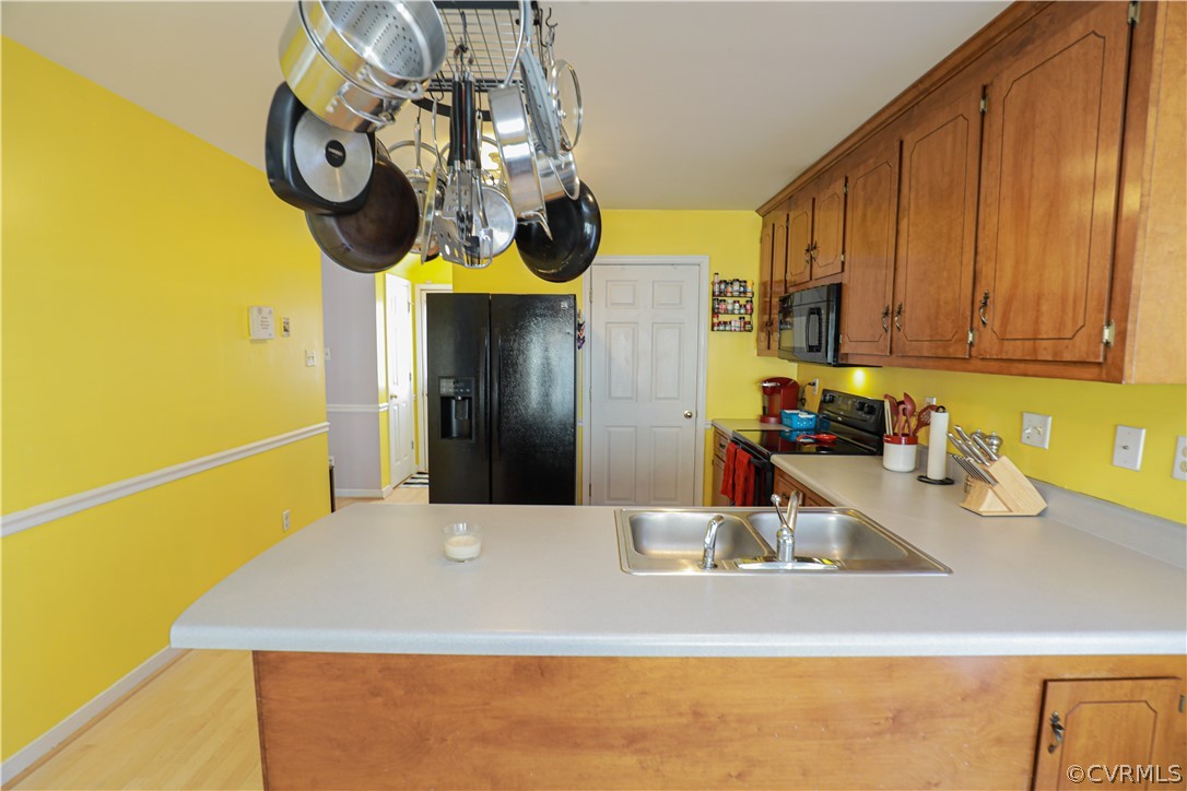 13824 Village Ridge Drive Midlothian, VA 23114 - Photo 13 of 43 a kitchen with a sink and refrigerator