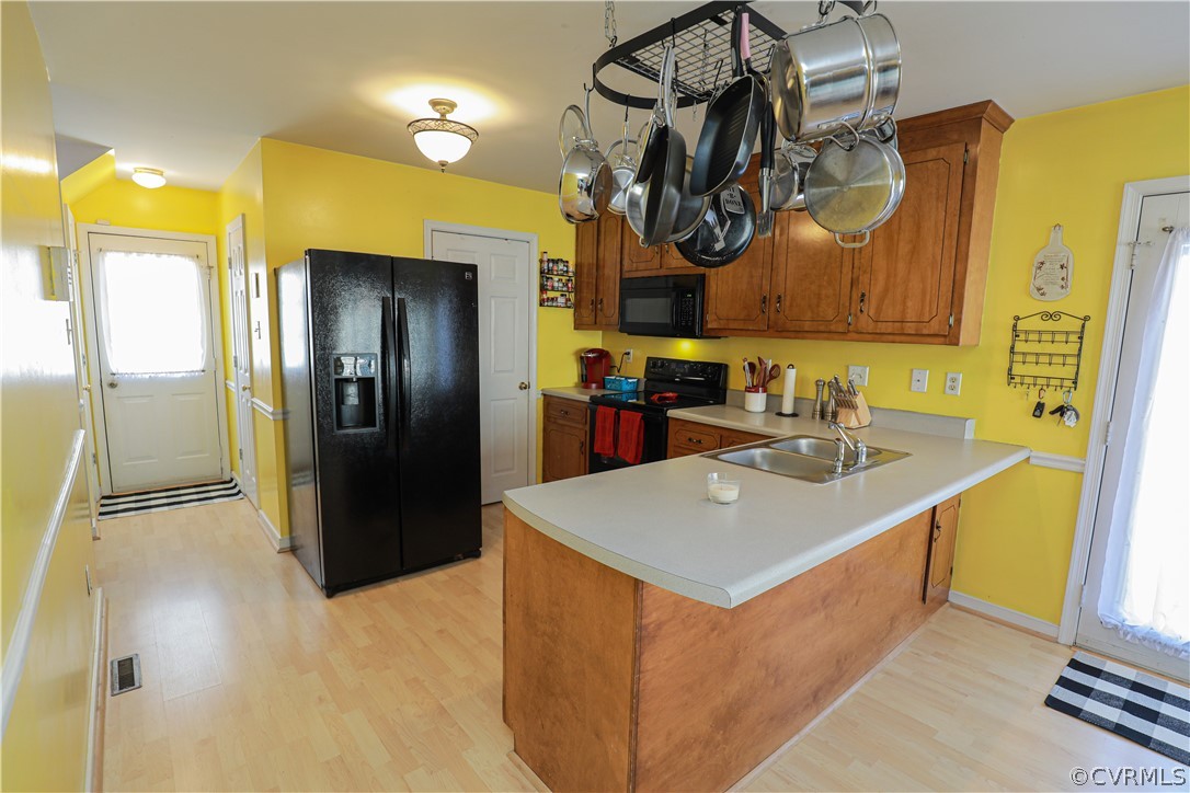 13824 Village Ridge Drive Midlothian, VA 23114 - Photo 14 of 43 a kitchen that has a sink and a refrigerator