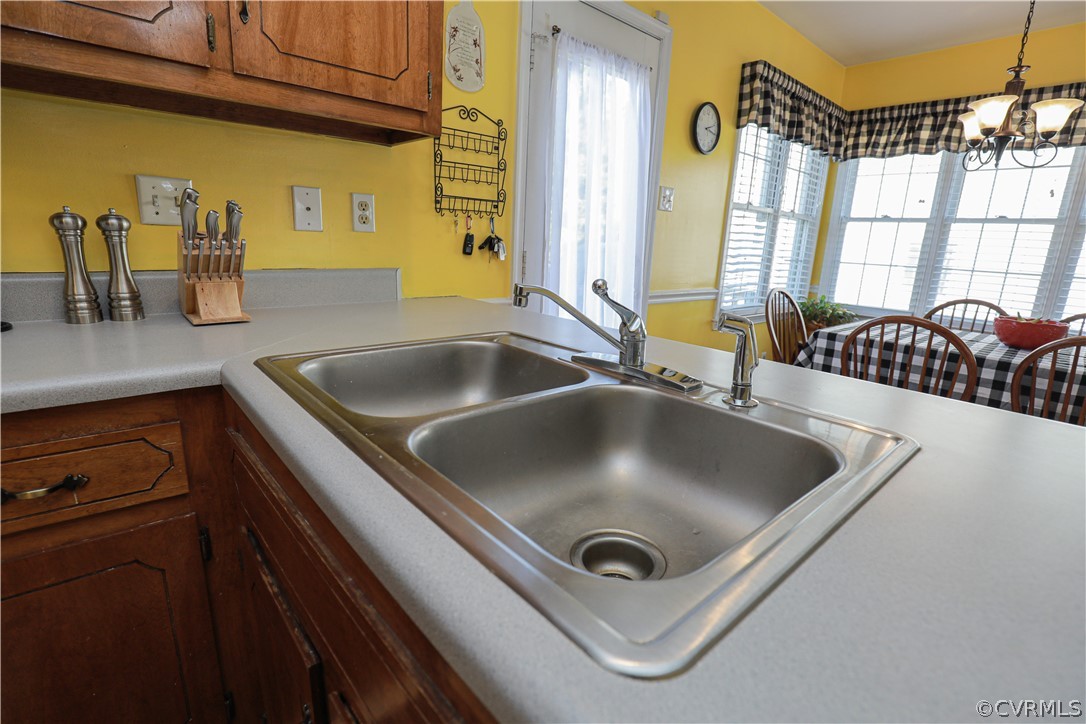 13824 Village Ridge Drive Midlothian, VA 23114 - Photo 16 of 43 a kitchen with a sink appliances and a counter top