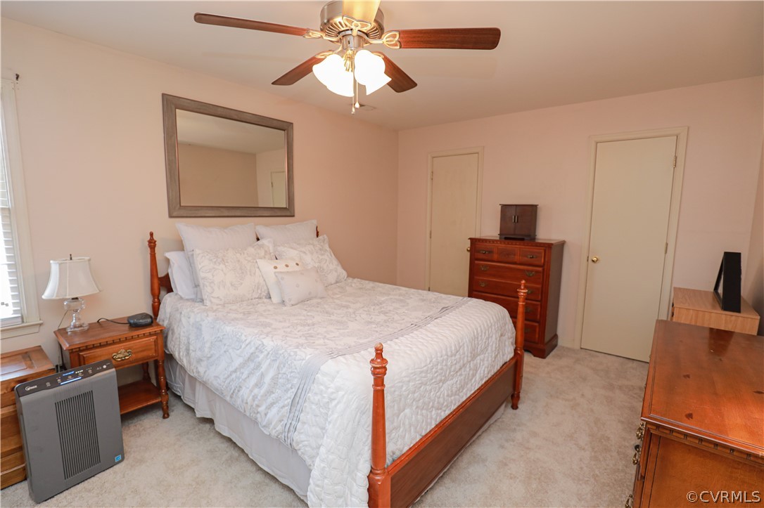 13824 Village Ridge Drive Midlothian, VA 23114 - Photo 22 of 43 a bedroom with a bed and a chandelier