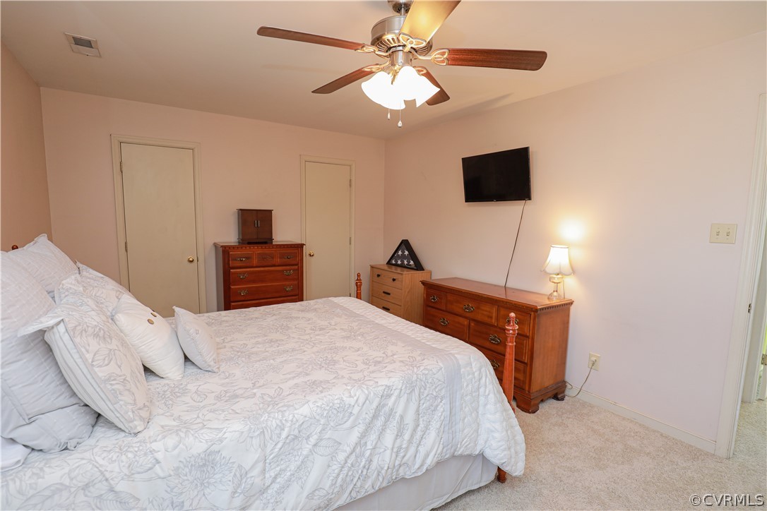 13824 Village Ridge Drive Midlothian, VA 23114 - Photo 23 of 43 a bedroom with a bed and a flat tv screen
