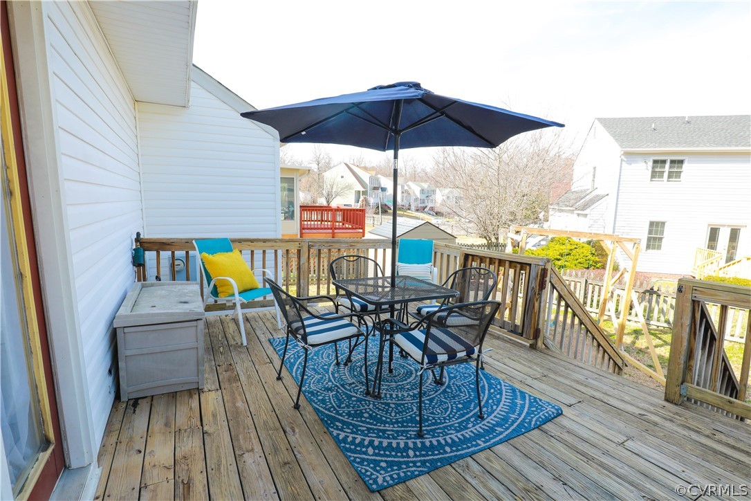 13824 Village Ridge Drive Midlothian, VA 23114 - Photo 36 of 43 a view of a roof deck with table and chairs