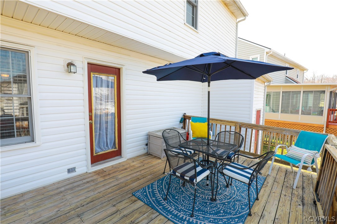 13824 Village Ridge Drive Midlothian, VA 23114 - Photo 38 of 43 a view of a chair and table on the deck