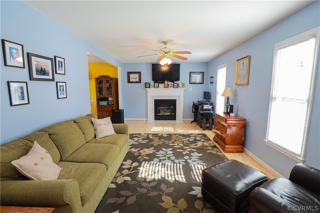 13824 Village Ridge Drive Midlothian, VA 23114 - Photo 5 of 43 a living room with furniture fireplace and flat screen tv