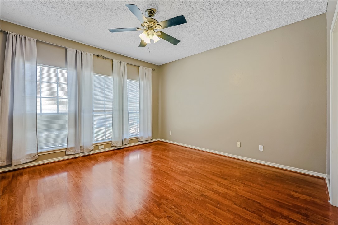 5917 Harvest Hill Road Corpus Christi, TX 78414 - Photo 28 of 40 wooden floor in an empty room with a window