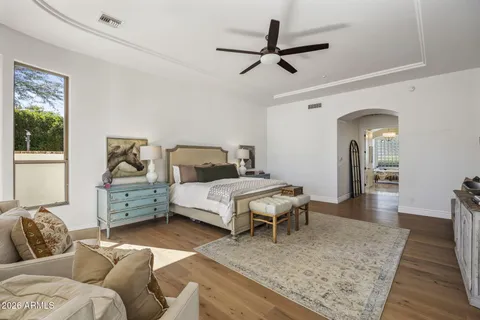 a bedroom with furniture and window