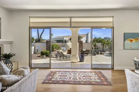 a living room with furniture and a rug