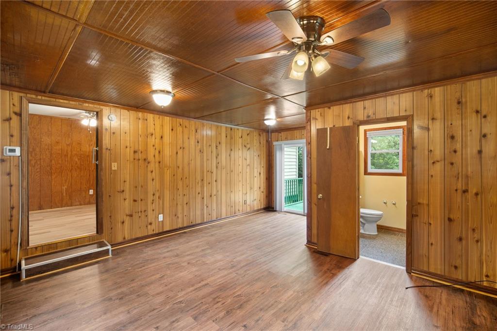 531 Frye Bridge Road Clemmons, NC 27012 - Photo 8 of 29 Large flex space could be used as a bedroom, office, living room, gaming room or more and features full bath and sliding doors to deck overlooking peaceful backyard.