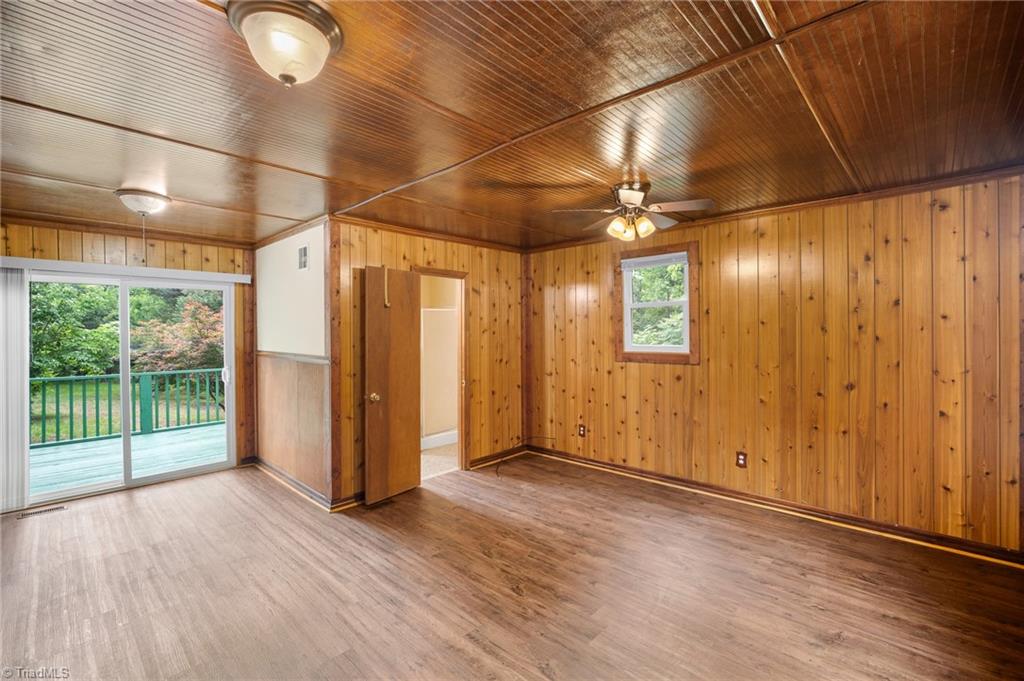 531 Frye Bridge Road Clemmons, NC 27012 - Photo 4 of 29 Large flex space could be used as a bedroom, office, living room, gaming room or more and features full bath and sliding doors to deck overlooking peaceful backyard.