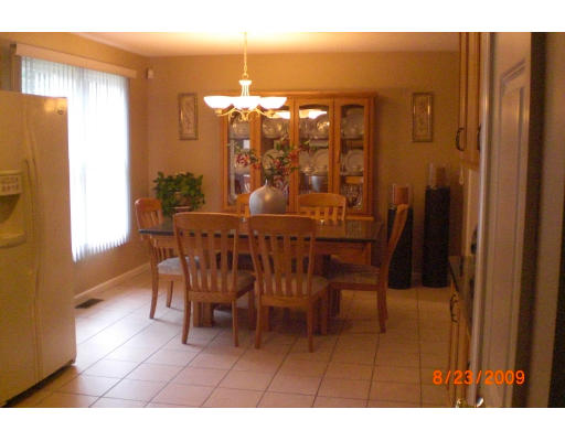 32 Wheeler Avenue Springfield, MA 01118 - Photo 3 of 7 a view of a dining room with furniture and chandelier
