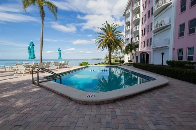 a view of a swimming pool with a lounge chairs