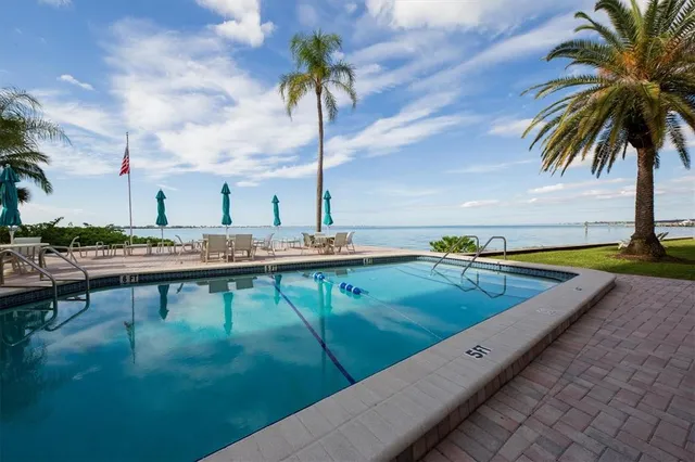 a view of swimming pool with chairs