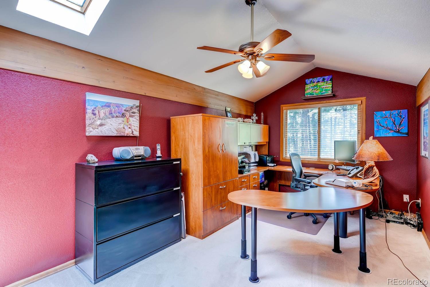 8045 Native Dancer Trail Evergreen, CO 80439 - Photo 19 of 29 a view of a livingroom with furniture and a chandelier