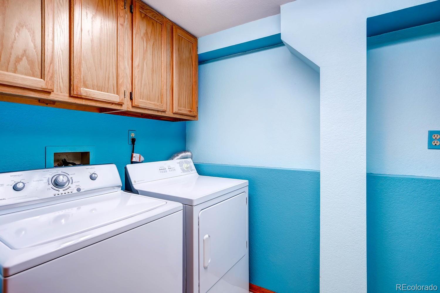 8045 Native Dancer Trail Evergreen, CO 80439 - Photo 24 of 29 a utility room with dryer and washer