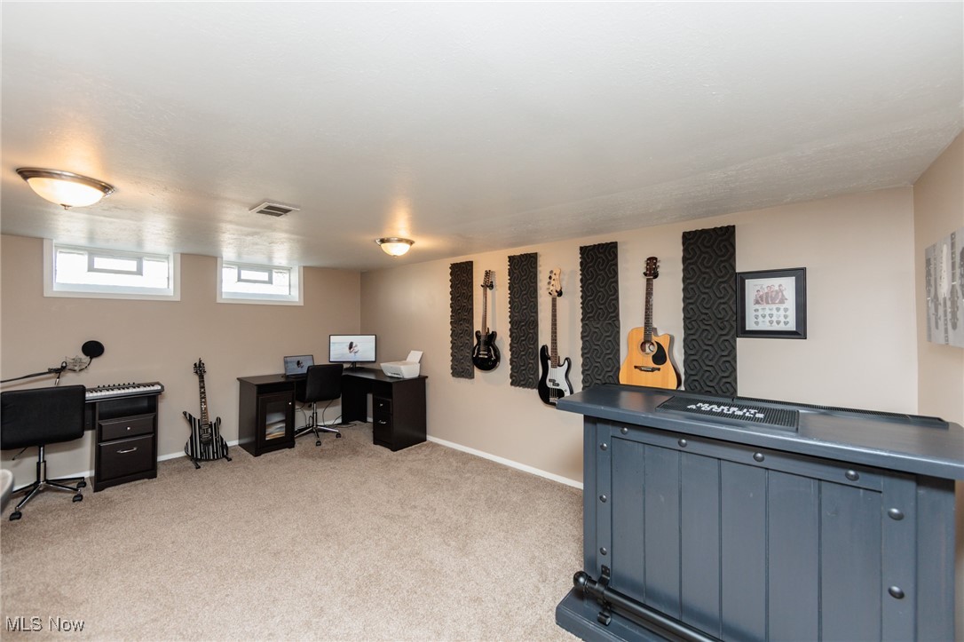 7316 Oakwood Road Parma, OH 44130 - Photo 21 of 41 Home office/bonus room featuring light carpet and baseboards