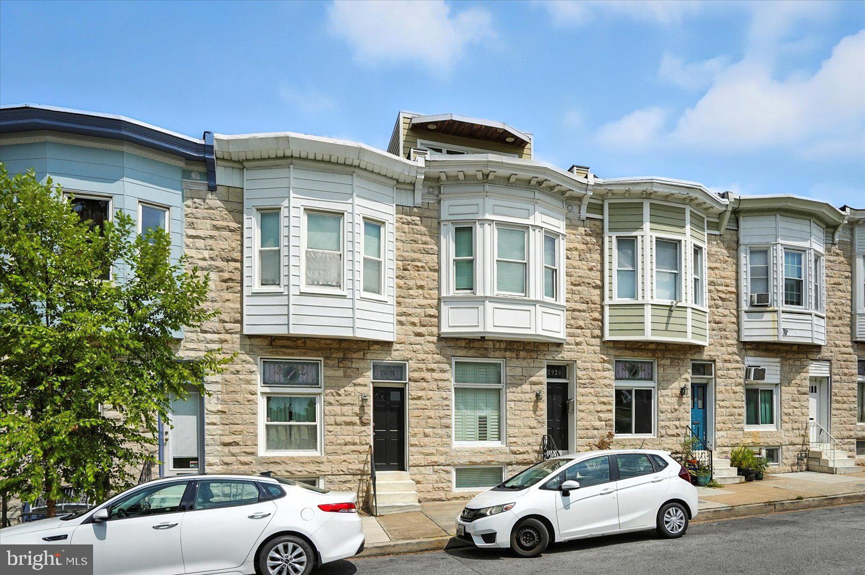 a front view of a house with parking space