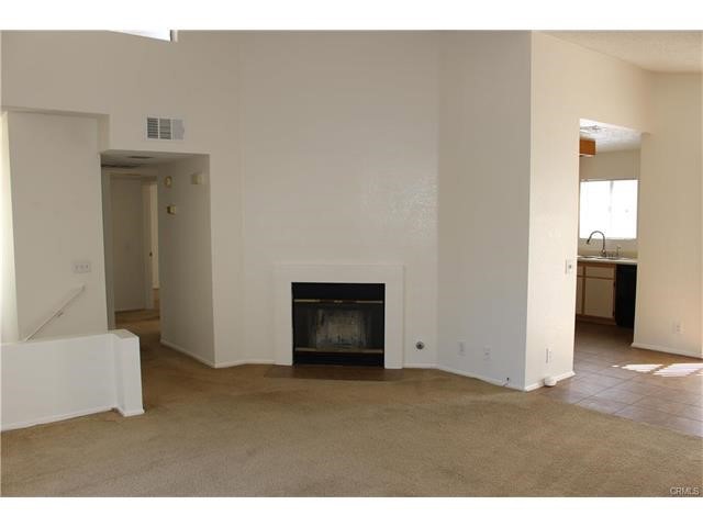 24202 Sylvan Glen Road, Unit F Diamond Bar, CA 91765 - Photo 4 of 8 a view of an empty room and fire place