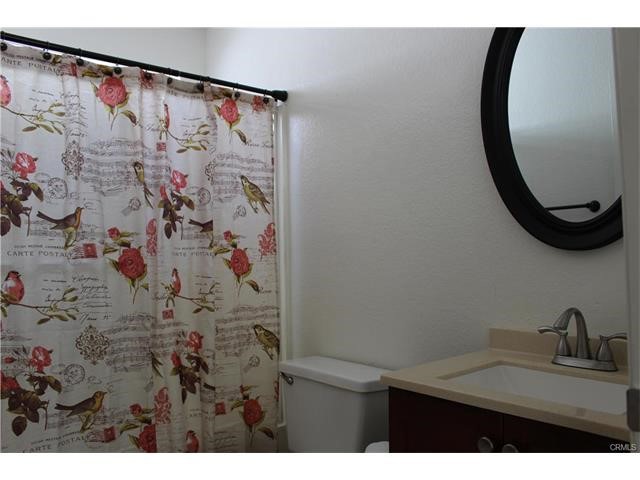 24202 Sylvan Glen Road, Unit F Diamond Bar, CA 91765 - Photo 6 of 8 a bathroom with a sink and a mirror