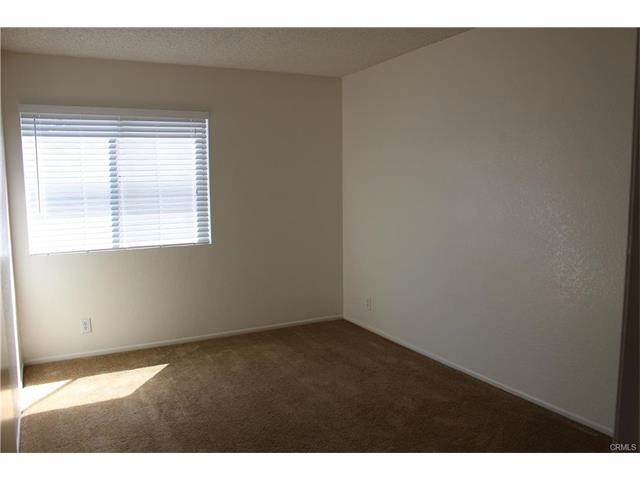 24202 Sylvan Glen Road, Unit F Diamond Bar, CA 91765 - Photo 7 of 8 a view of an empty room with a window