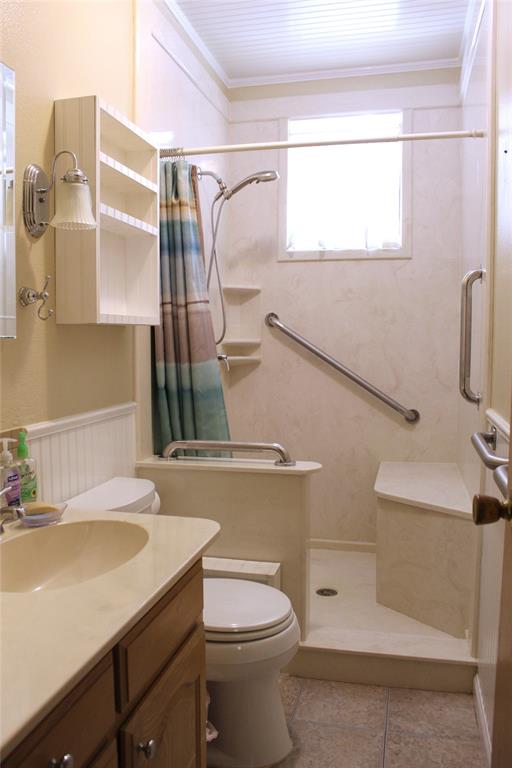 5050 Highway 67, Unit 377N Comanche, TX 76442 - Photo 15 of 30 a bathroom with a sink toilet and shower
