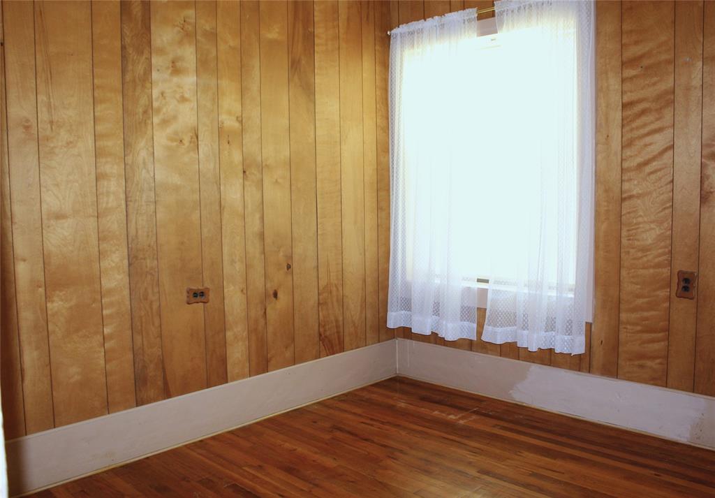 5050 Highway 67, Unit 377N Comanche, TX 76442 - Photo 18 of 30 a view of a room with wooden floor