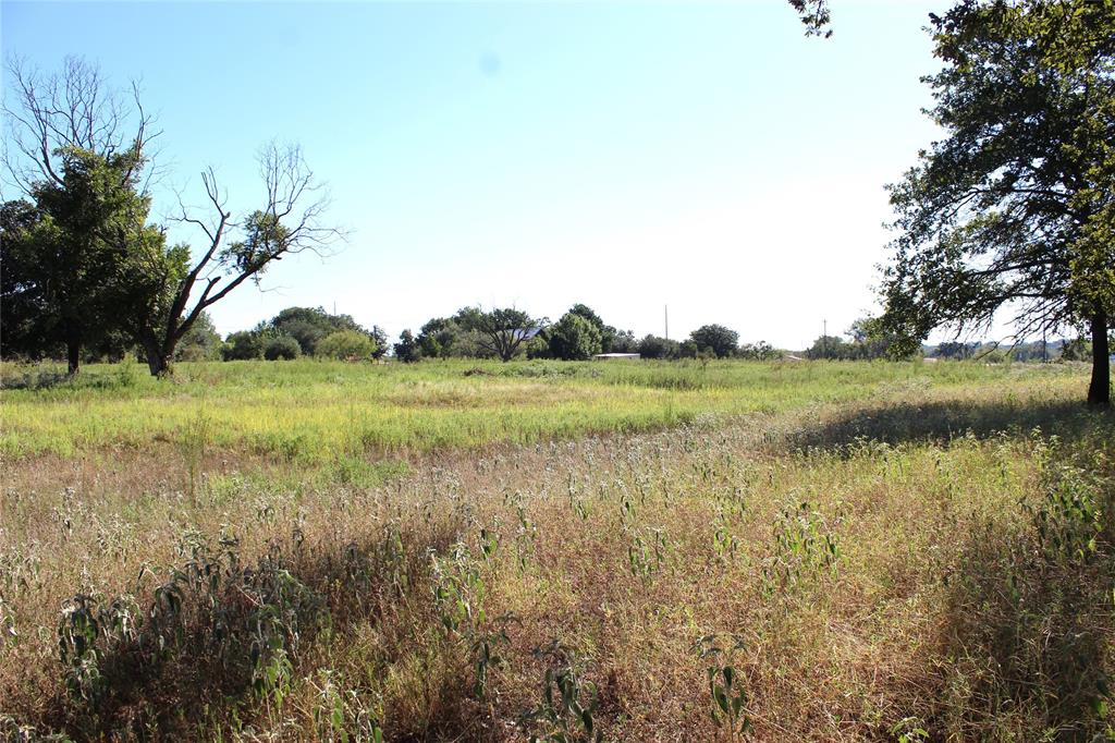 5050 Highway 67, Unit 377N Comanche, TX 76442 - Photo 29 of 30 a view of a lake with a yard