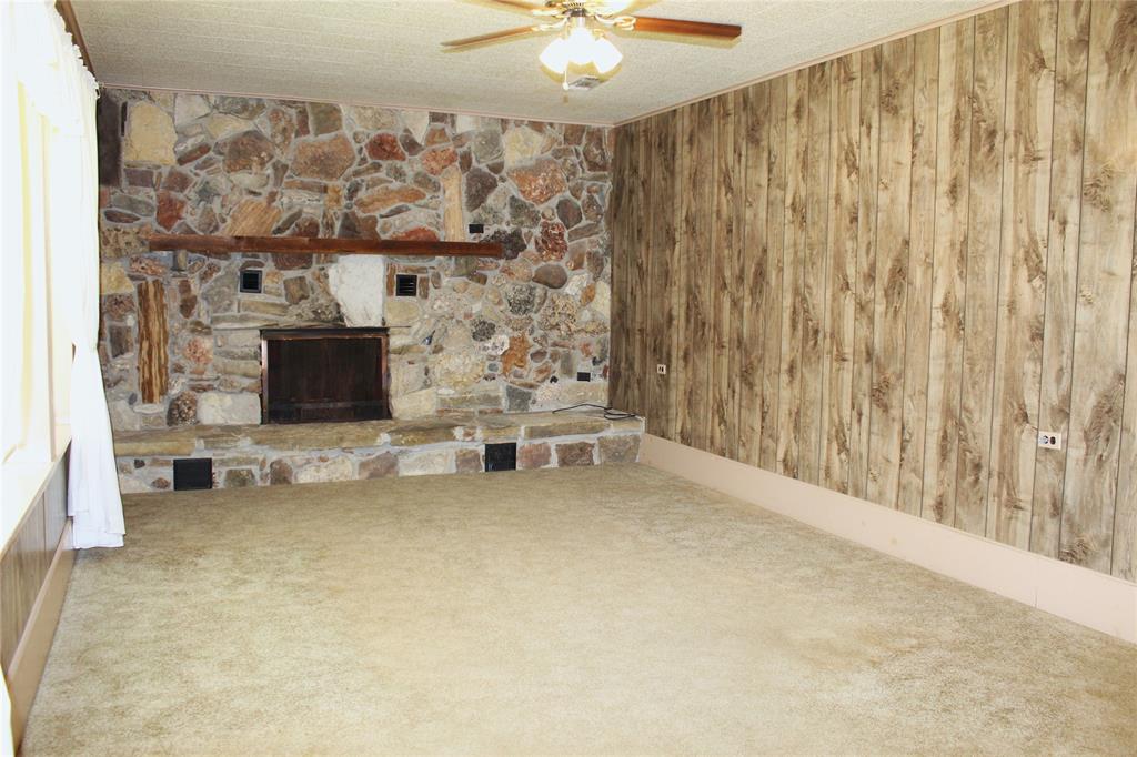 5050 Highway 67, Unit 377N Comanche, TX 76442 - Photo 6 of 30 a view of livingroom with furniture and a fireplace