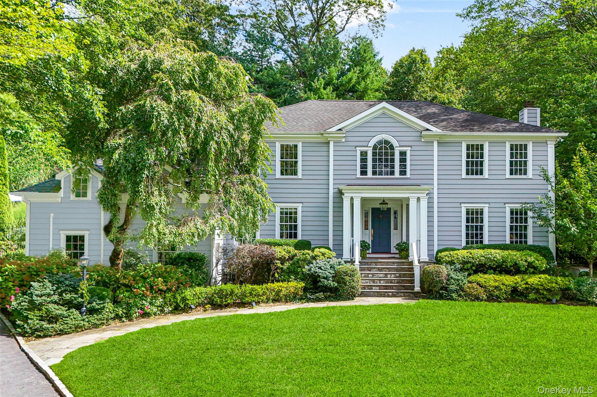 Welcome to 10 Hilltop Road, a stunning Colonial set on a quiet cul-de-sac in Larchmont.