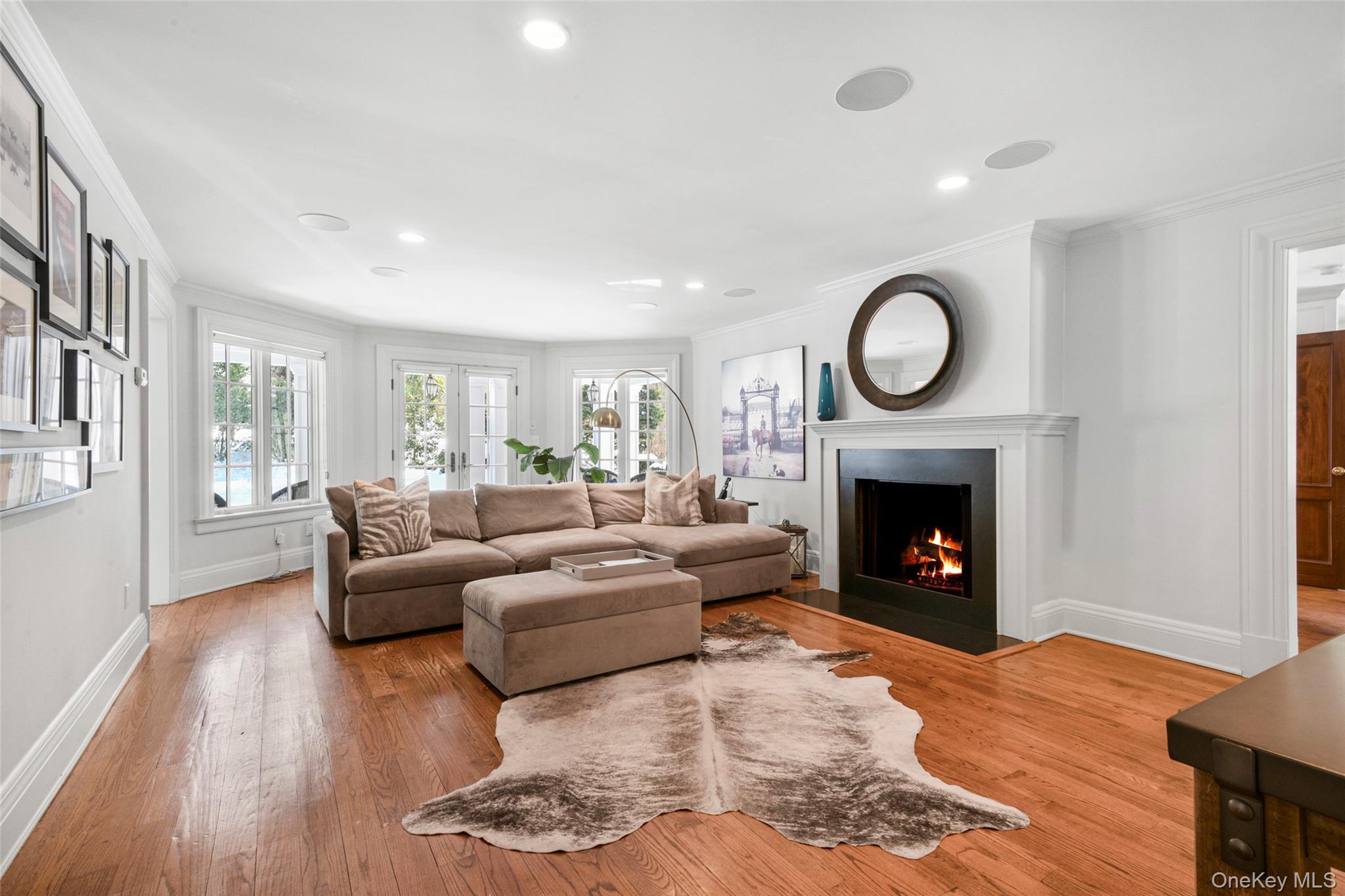 10 Hilltop Road Larchmont, NY 10538 - Photo 15 of 50 Spacious family room with wood-burning fireplace and French doors leading to a covered back porch.